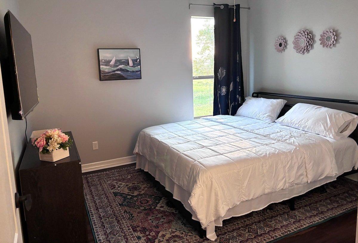 Guest Room 2 with backyard views and smart TV