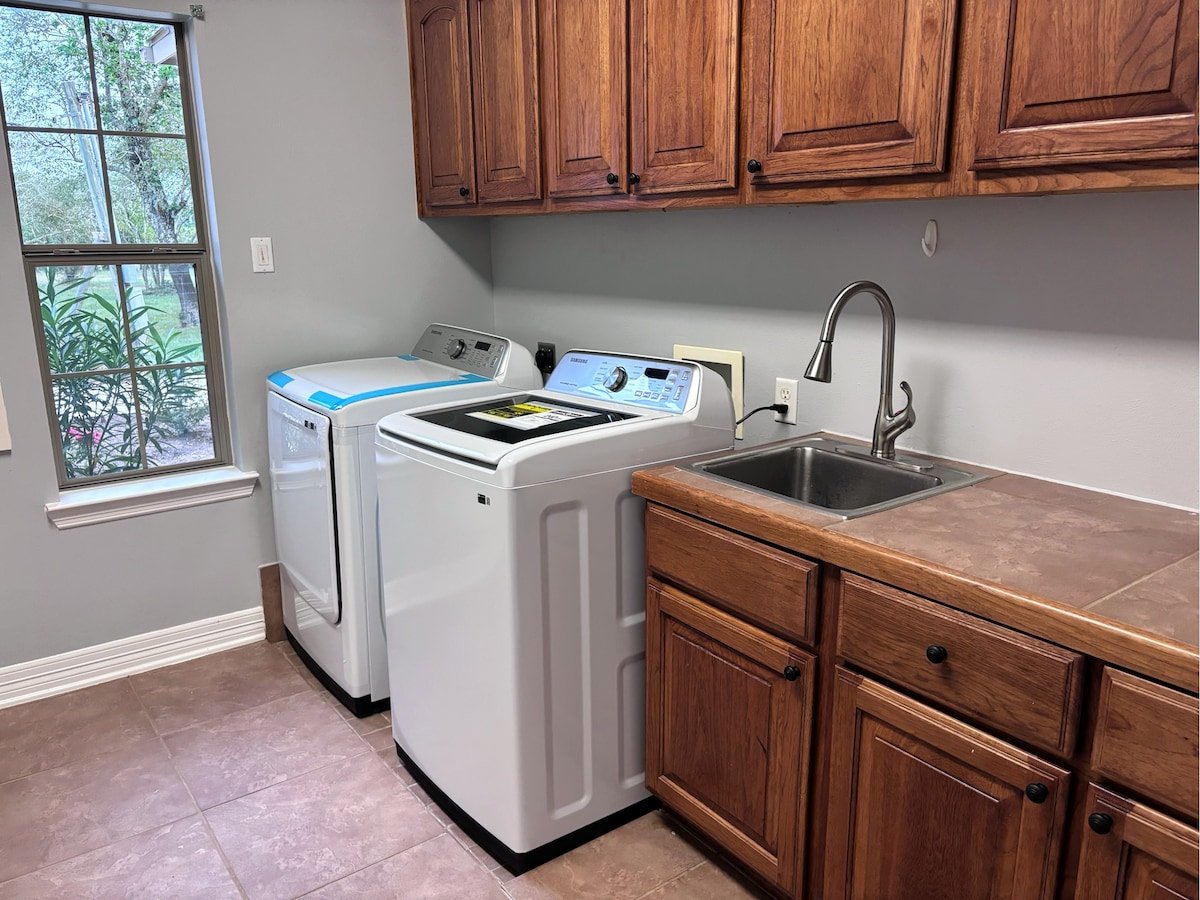 Washer and dryer with water sink